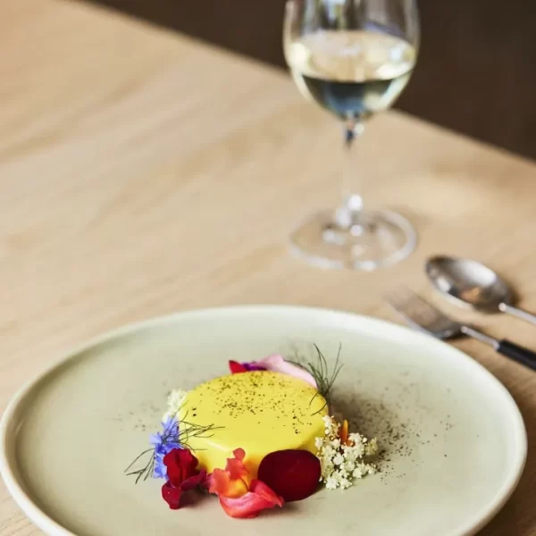 Caramelised white chocolate mousse, passionfruit, salted caramel, local flowers.