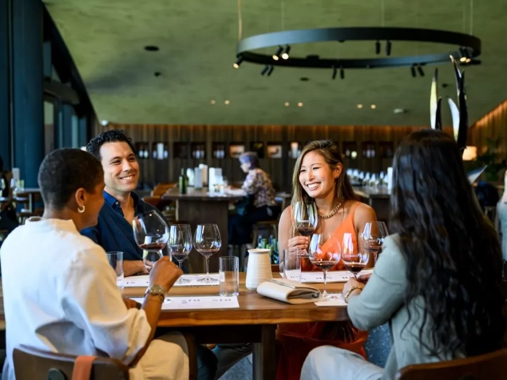 Yarra Valley Wine tour - Group of four people enjoying tasting at Huberts Estate